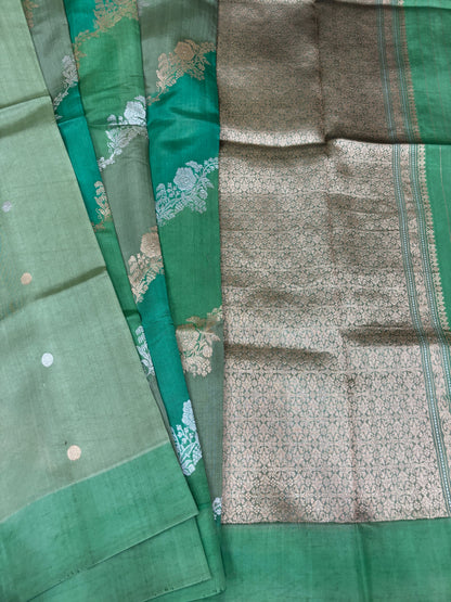 Green silk saree with teal and silver patterned sections plus contrast border