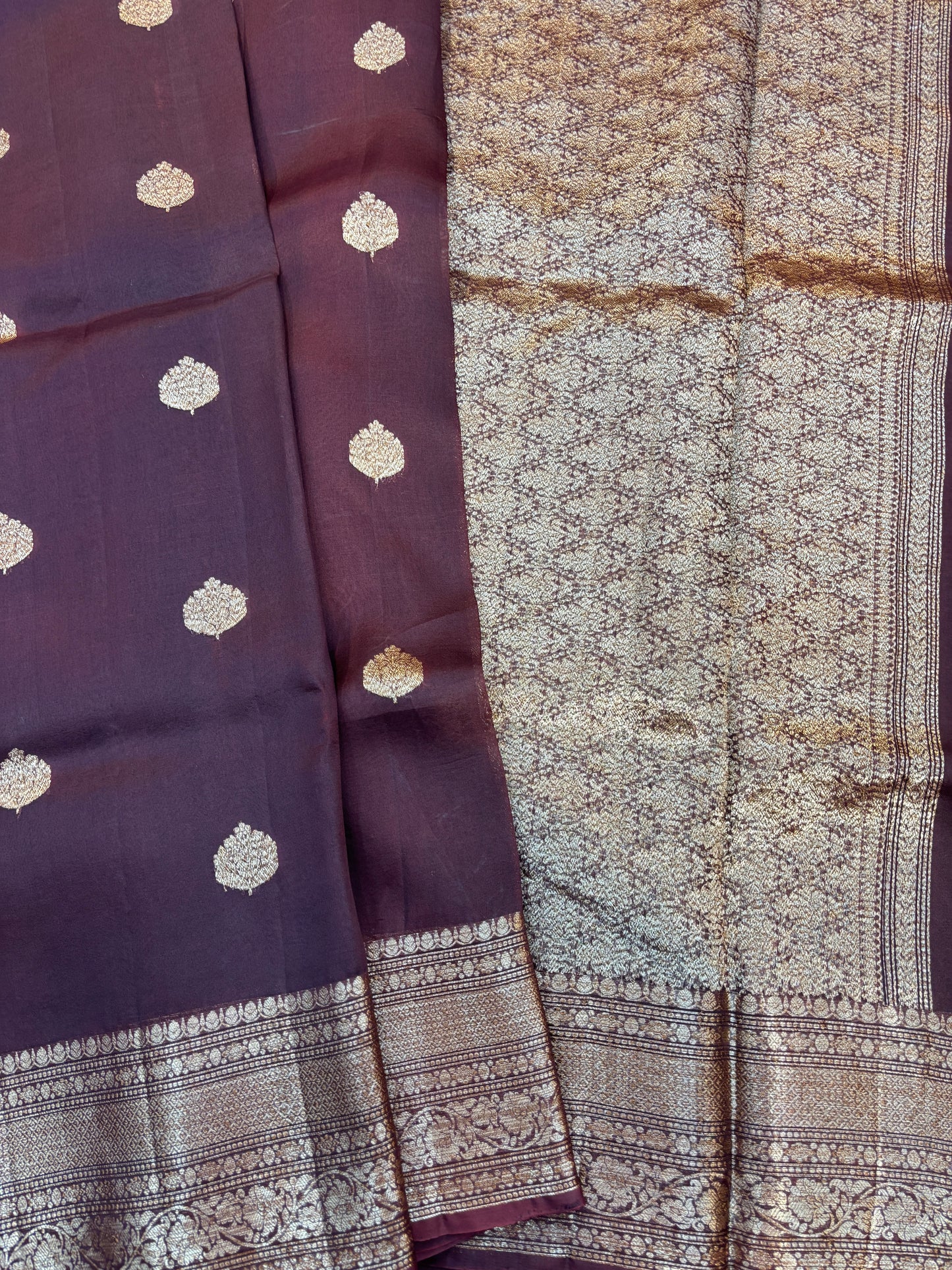 Plum silk saree with gold dot motifs, patterned pallu panel, and zari border