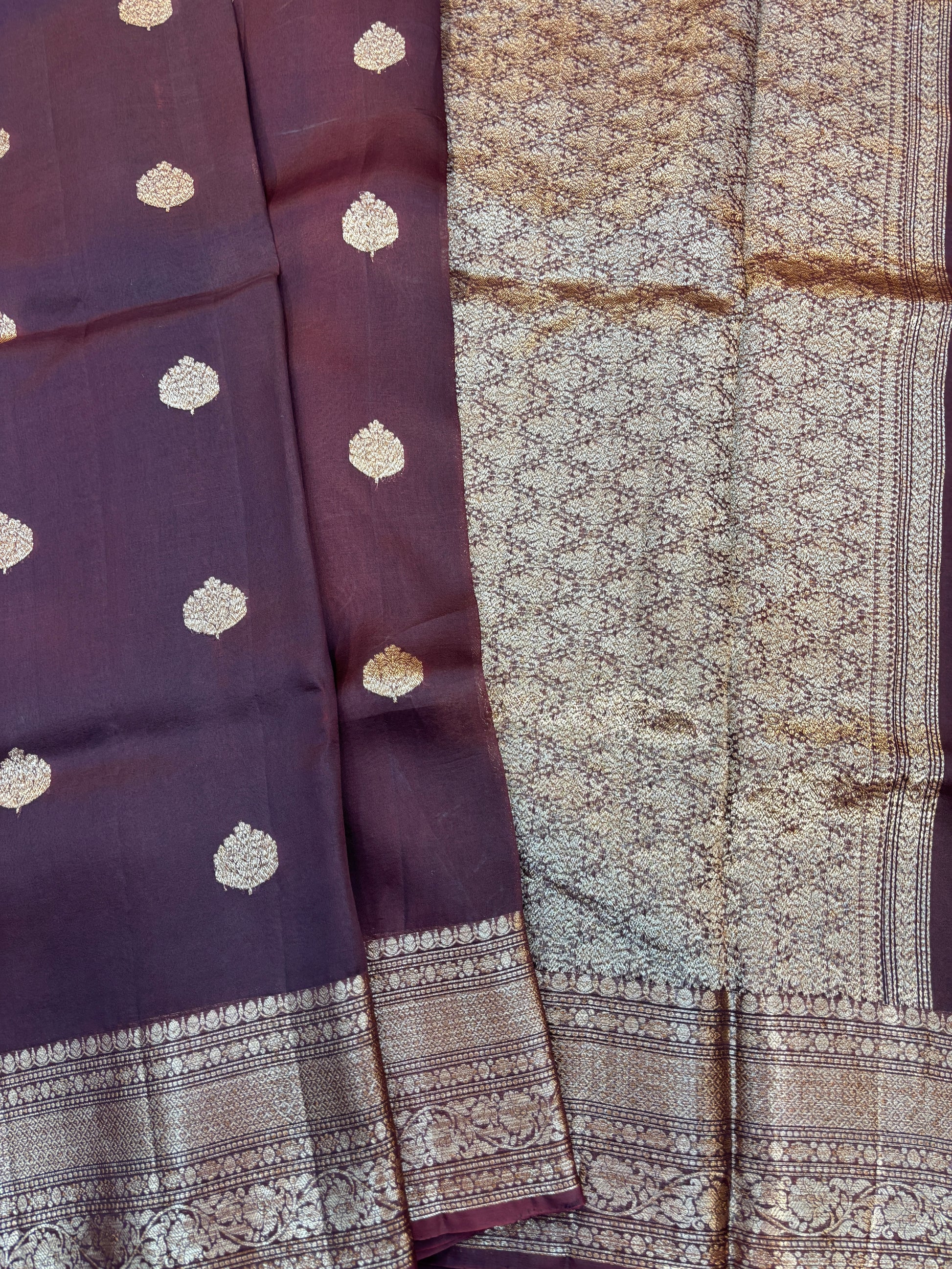 Plum silk saree with gold dot motifs, patterned pallu panel, and zari border