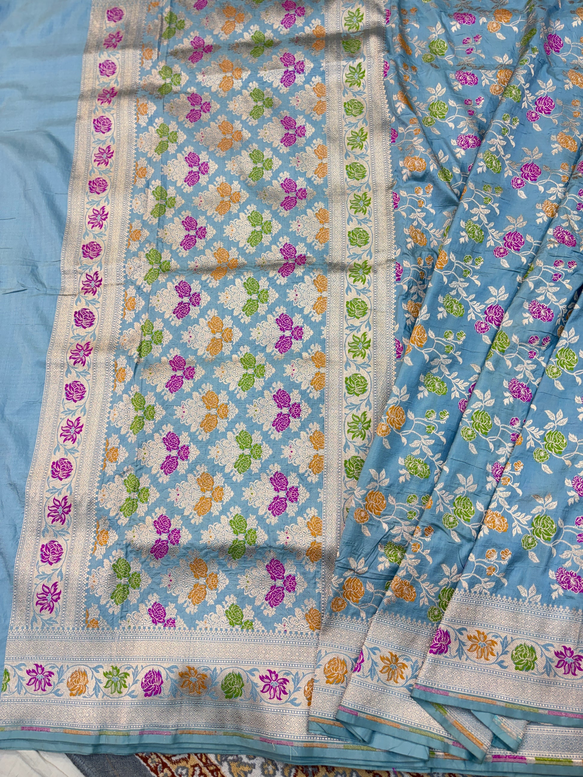 Powder blue Katan silk saree with multicolor flower grid pattern and blue border