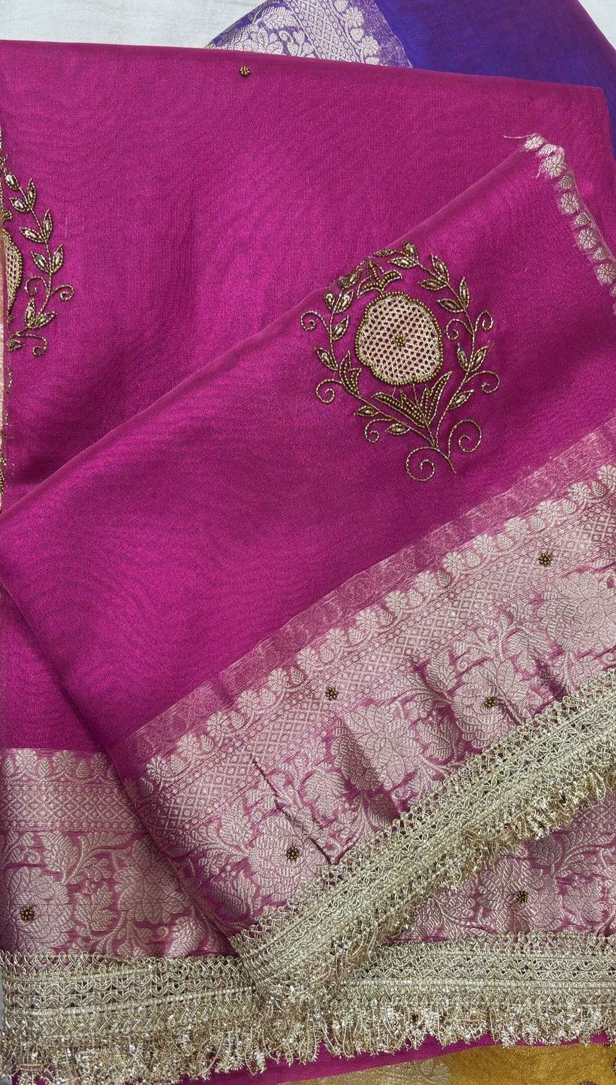 Pink Banarasi sari with tissue weave and gold zardozi-style circular lace motif; ornate border