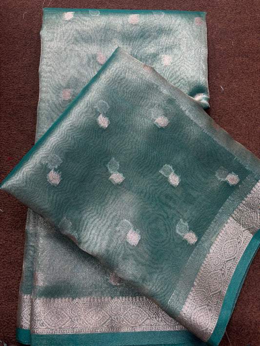 Banarasi tissue sari with teal fabric, pink dot motifs, and teal-gold border