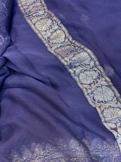 Purple chiffon saree with silver zari border and detailed woven pattern strip