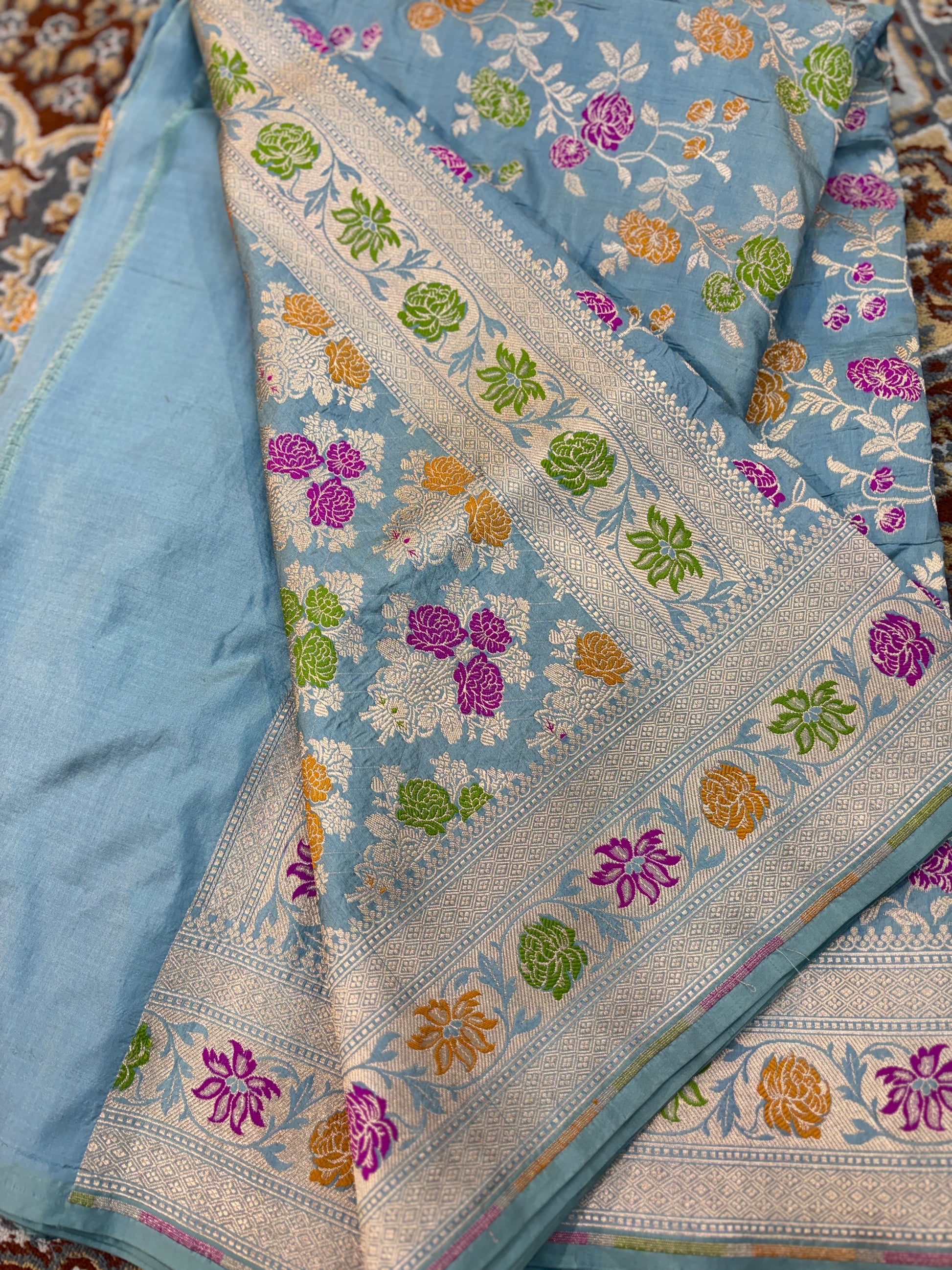 Powder blue Katan silk Banarasi saree close border with multicolor floral motifs