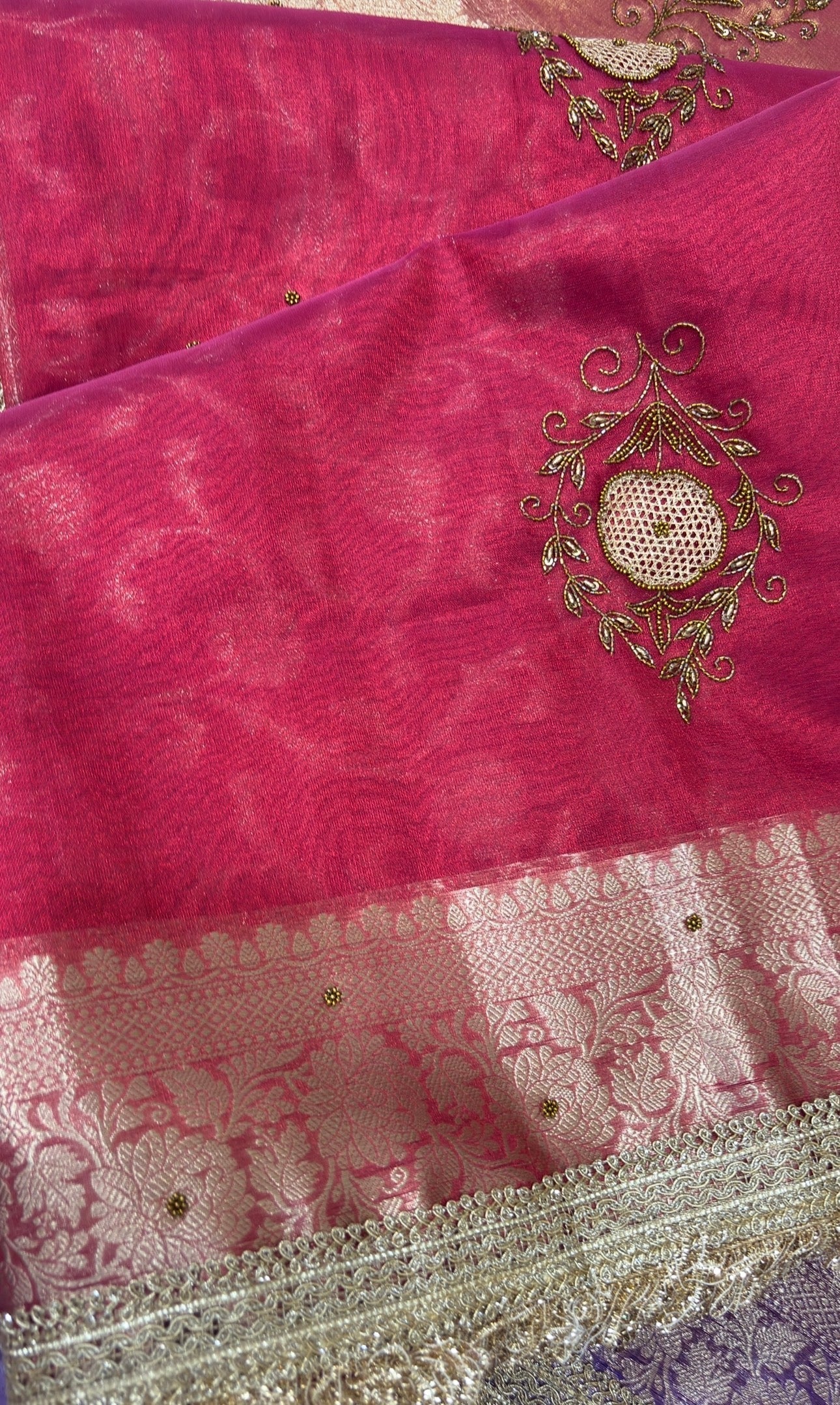 Red Banarasi sari with gold zardoji motifs and ornate silver-gold lace border