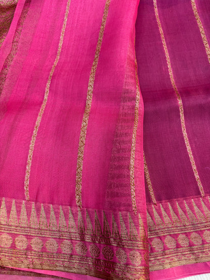 Pink silk saree with gold zari stripes and woven border