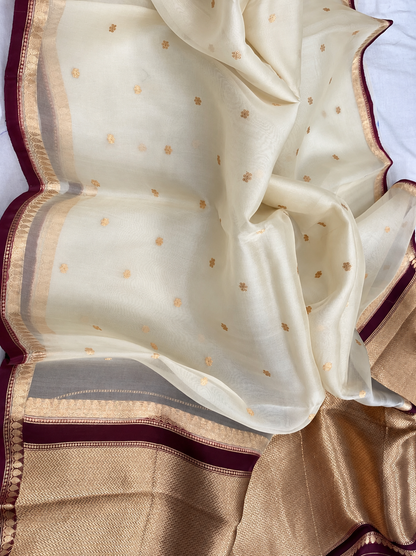 Ivory silk saree with small gold motifs and maroon-gold border
