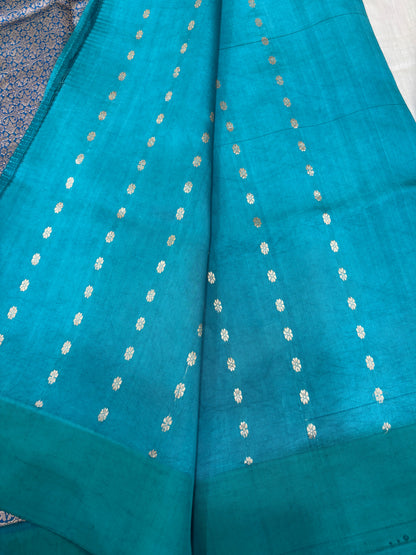 Teal silk saree with small gold dot motifs and woven border