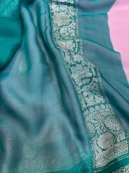 Teal chiffon saree with embroidered silver border detail along the edge