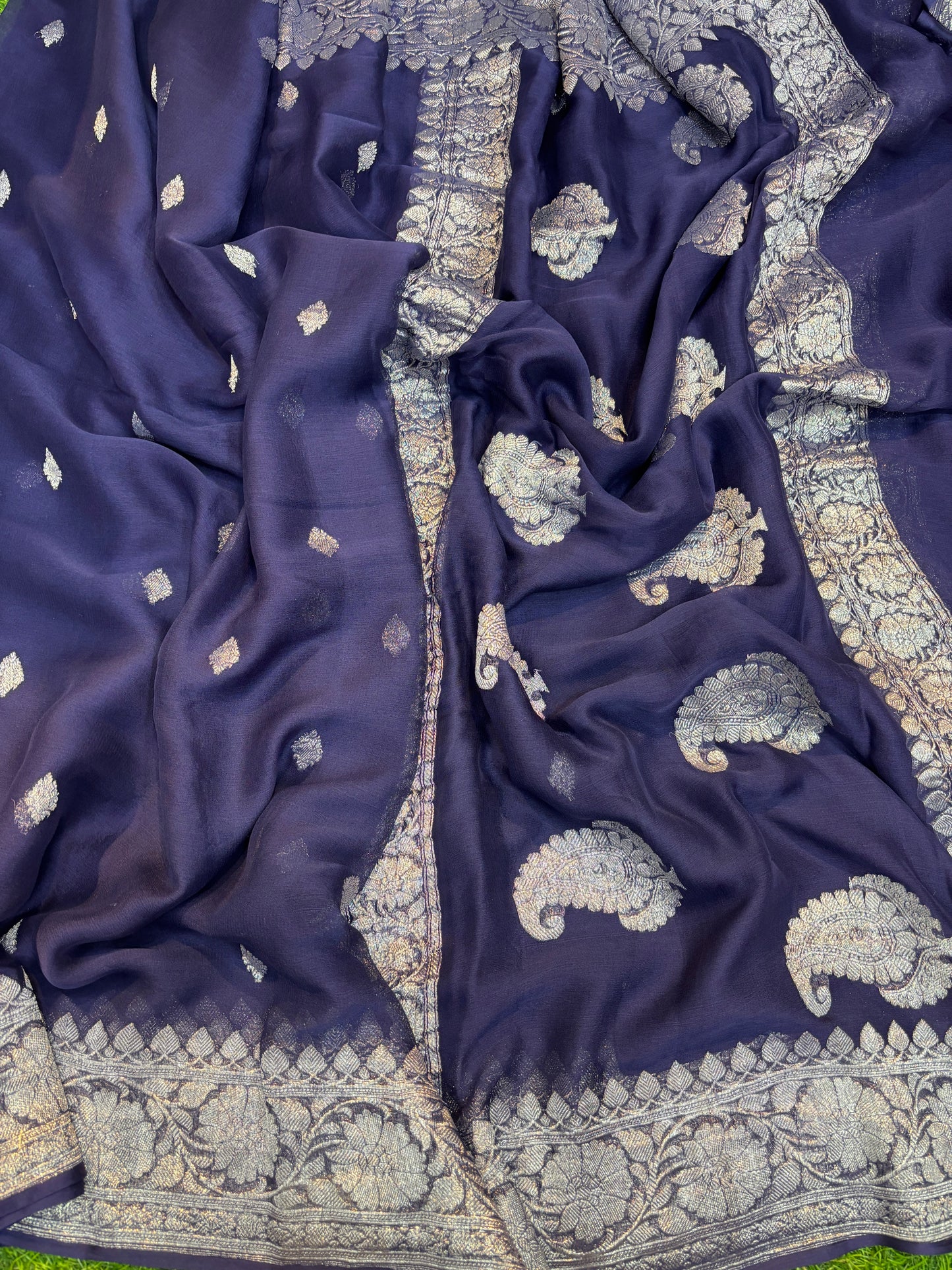 Navy blue chiffon saree with gold zari leaf buta and ornate border