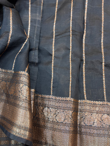 Black silk saree with gold zari stripes and ornate antique zari border