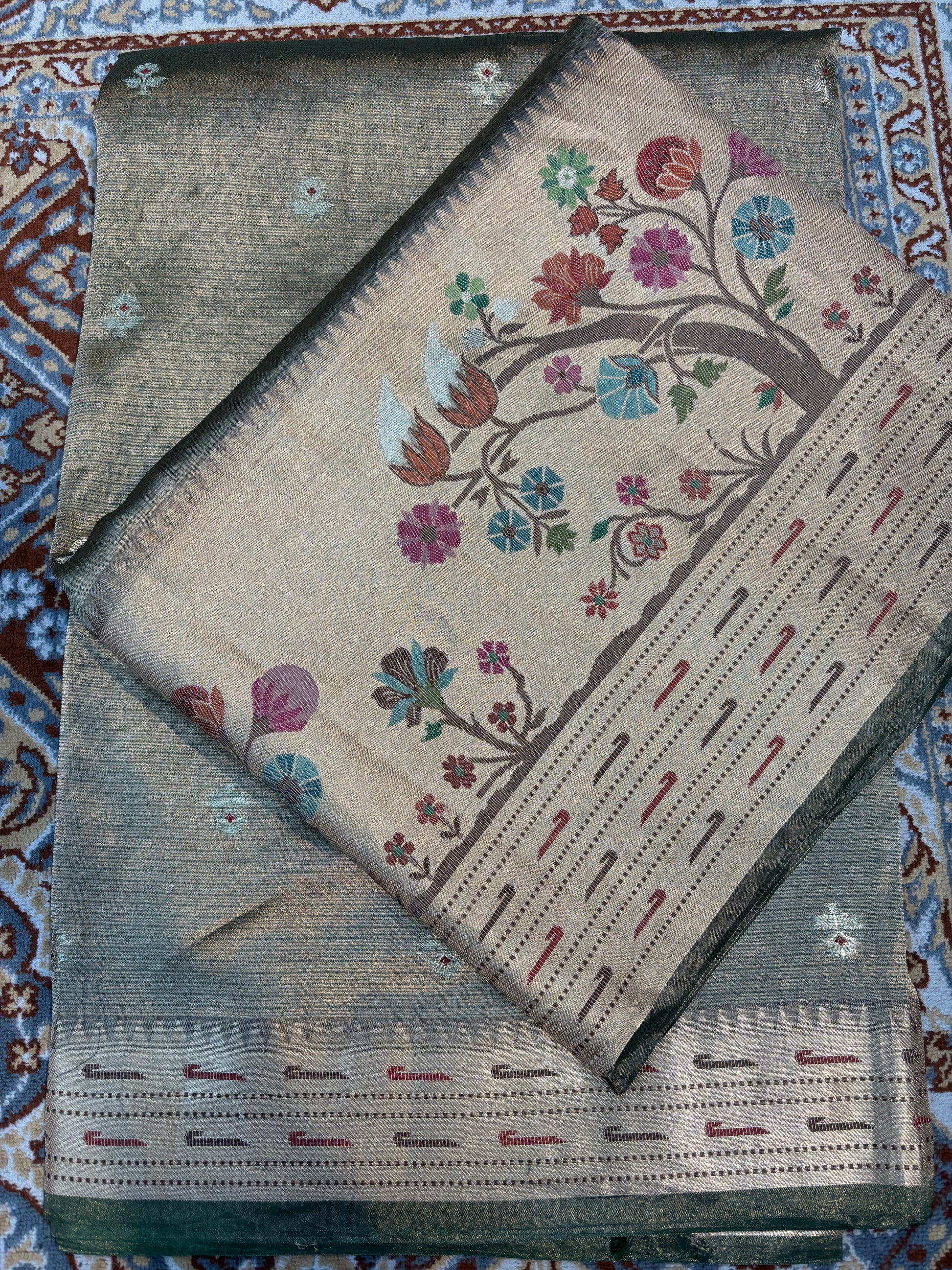 Light grey saree with floral pallu panel, colorful flowers and dotted stripe edge