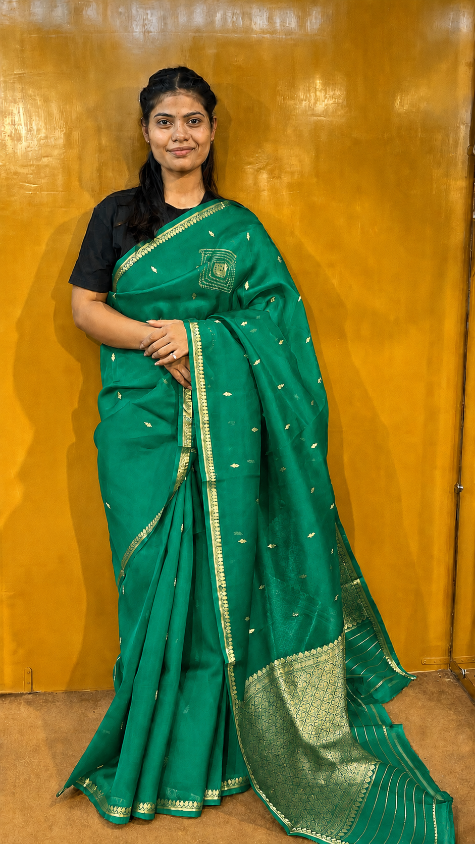 Green Banarasi handloom saree with gold zari border and small metallic motifs