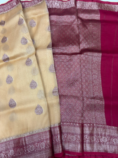 Beige silk saree with purple teardrop motifs and maroon zari border