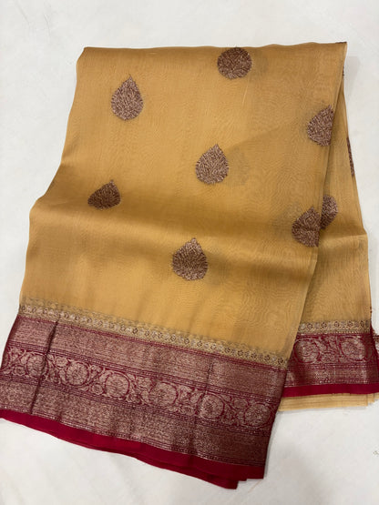 Gold silk saree with purple teardrop motifs and maroon woven border