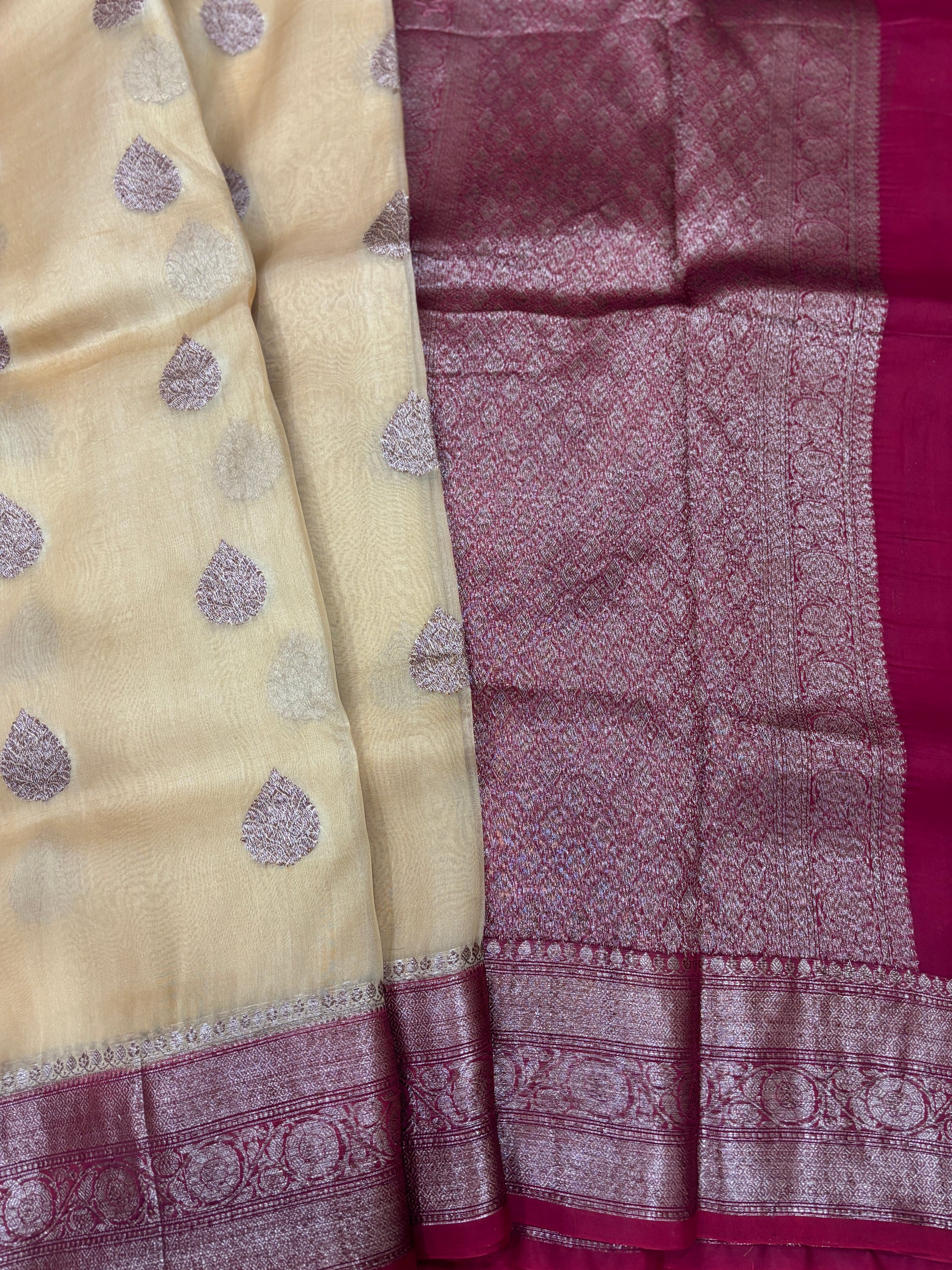 Beige silk saree with purple motifs, maroon panel, and woven zari border