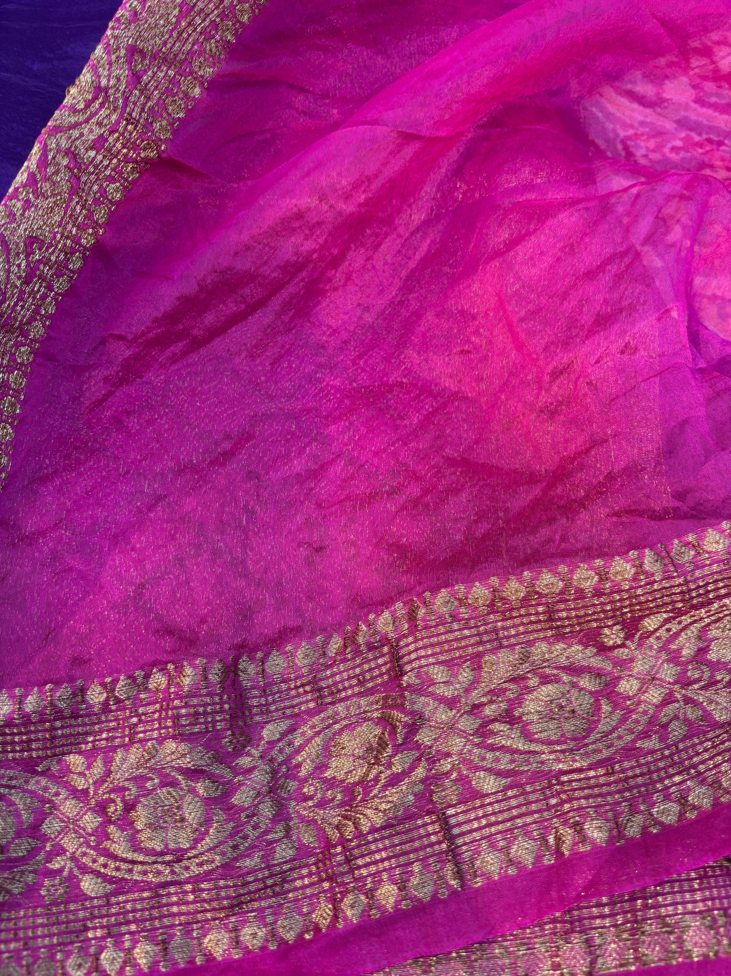 Banarasi handloom saree with magenta pink drape and gold patterned border strip