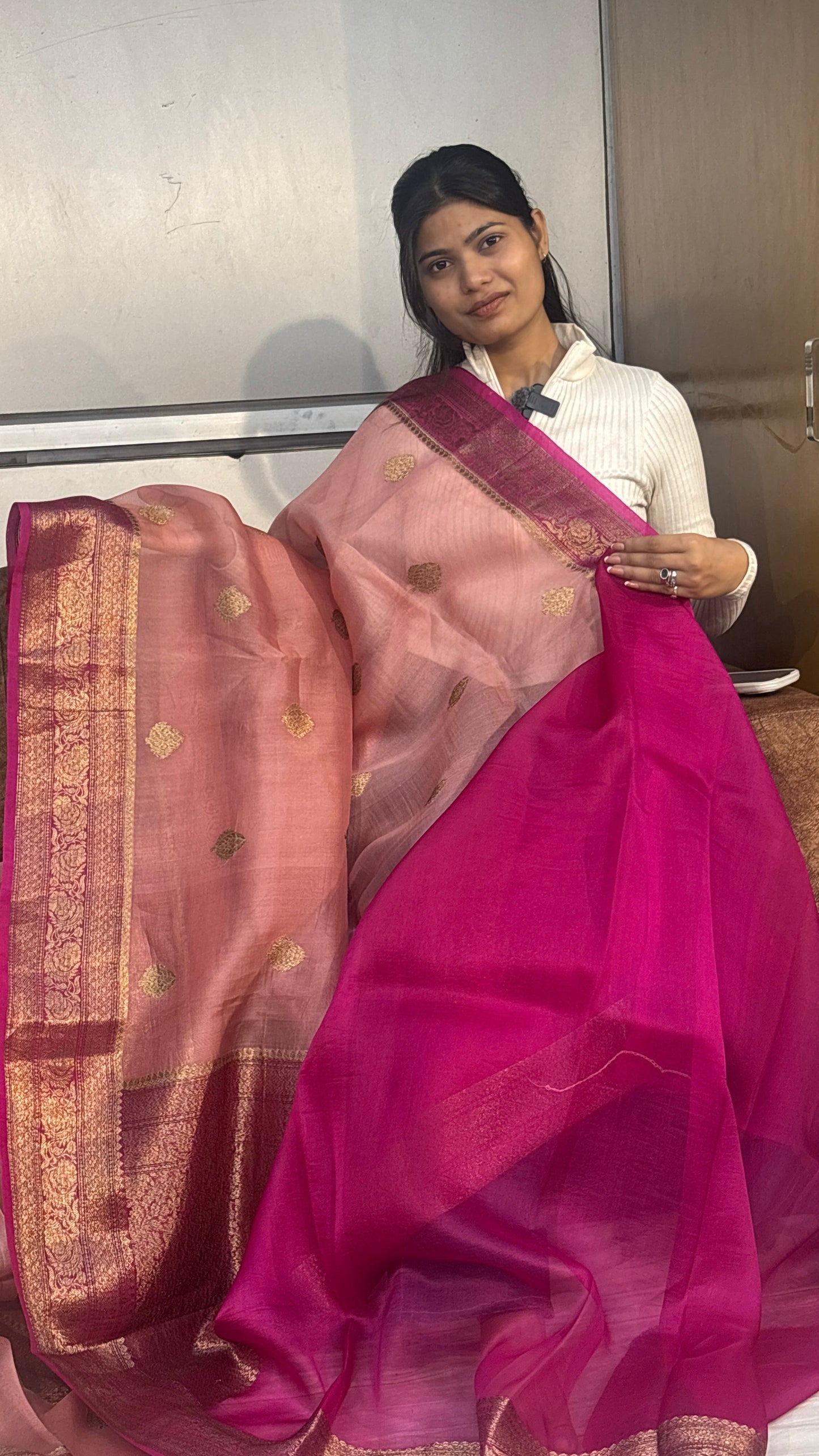 Pink and magenta Banarasi silk saree with antique zari border and woven motifs