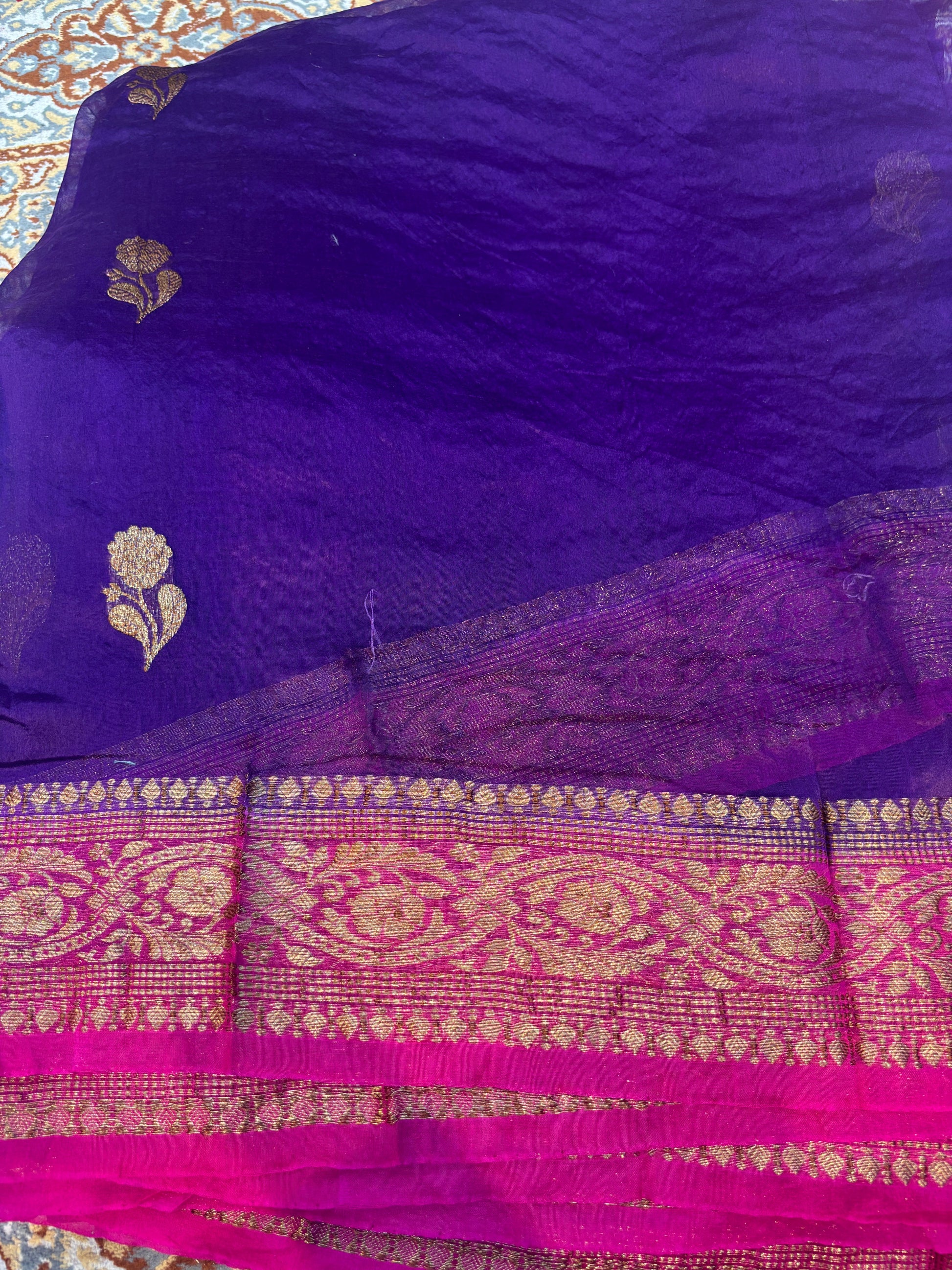 Banarasi handloom saree with deep blue body and gold paisley border with pink panel