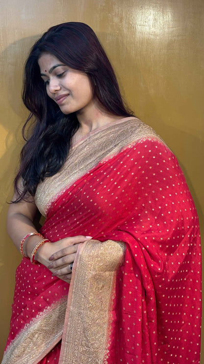 Red saree with gold zari border and pallu, small dotted pattern