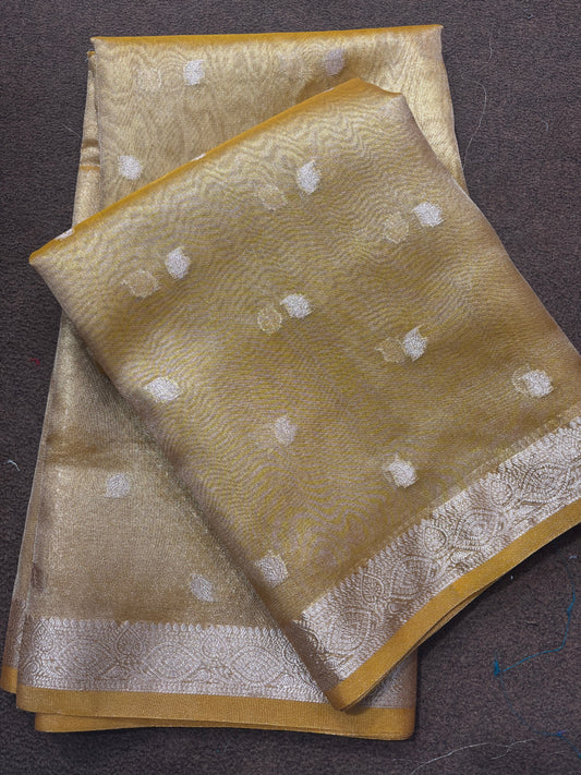 Yellow tissue Banarasi sari with white dot pattern and silver border