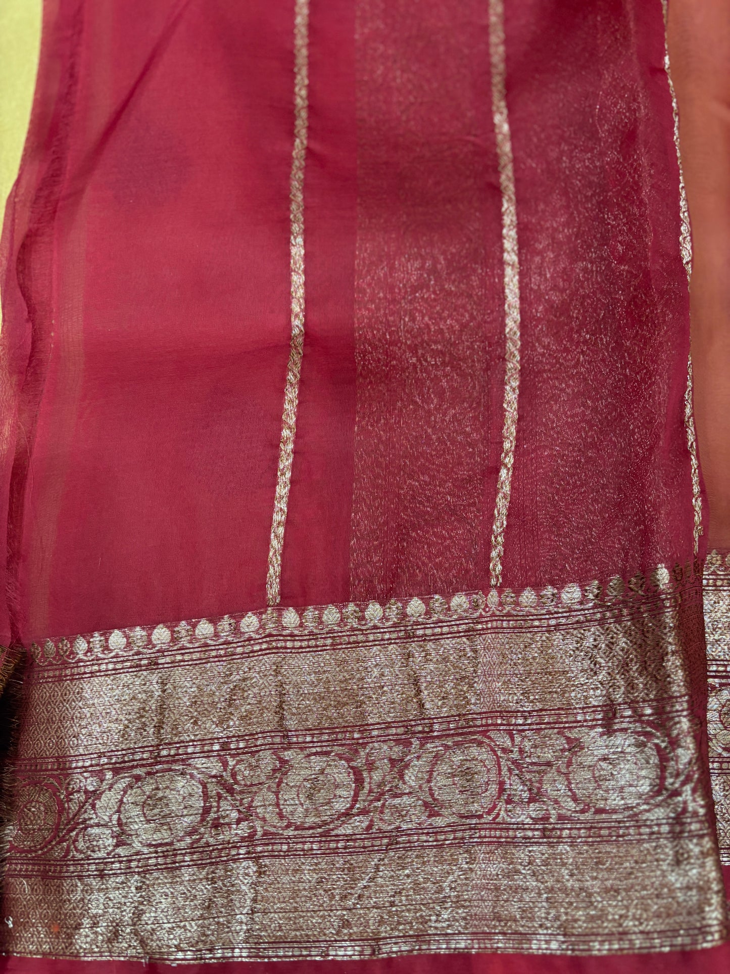 Maroon silk saree border with gold zari stripes and ornate patterned band