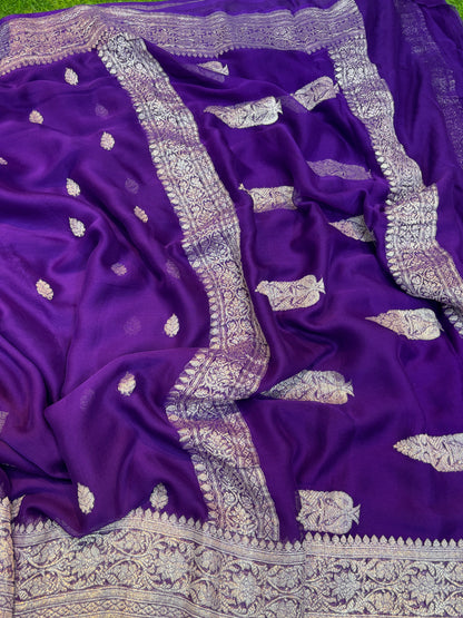 Royal blue chiffon saree with silver leaf buta and wide ornate border