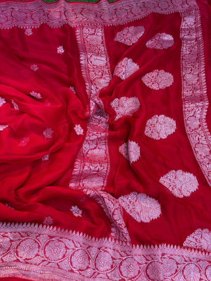 Red chiffon saree with silver zari buta motifs and decorative border