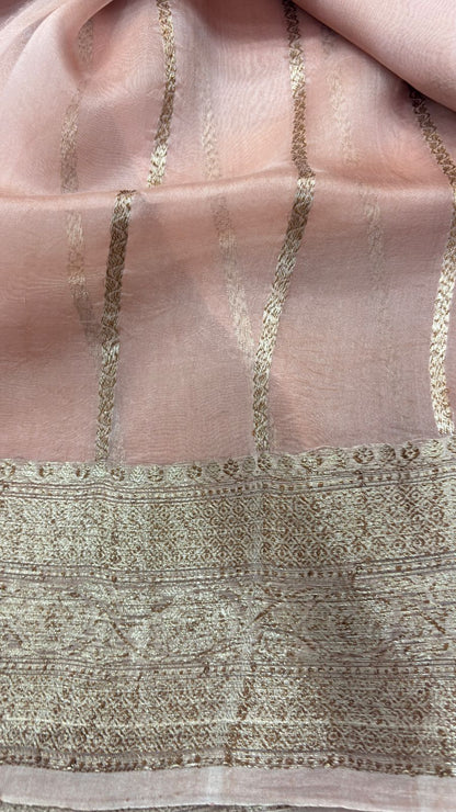 Peach pink saree pallu with vertical gold zari lines and patterned border